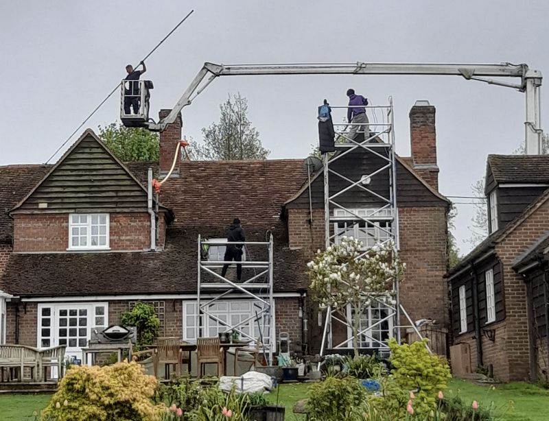 The Roof Moss Cleaners using cherry picker and scaffolding to clean roof safely and professionally in Royal Leamington Spa, Warwickshire